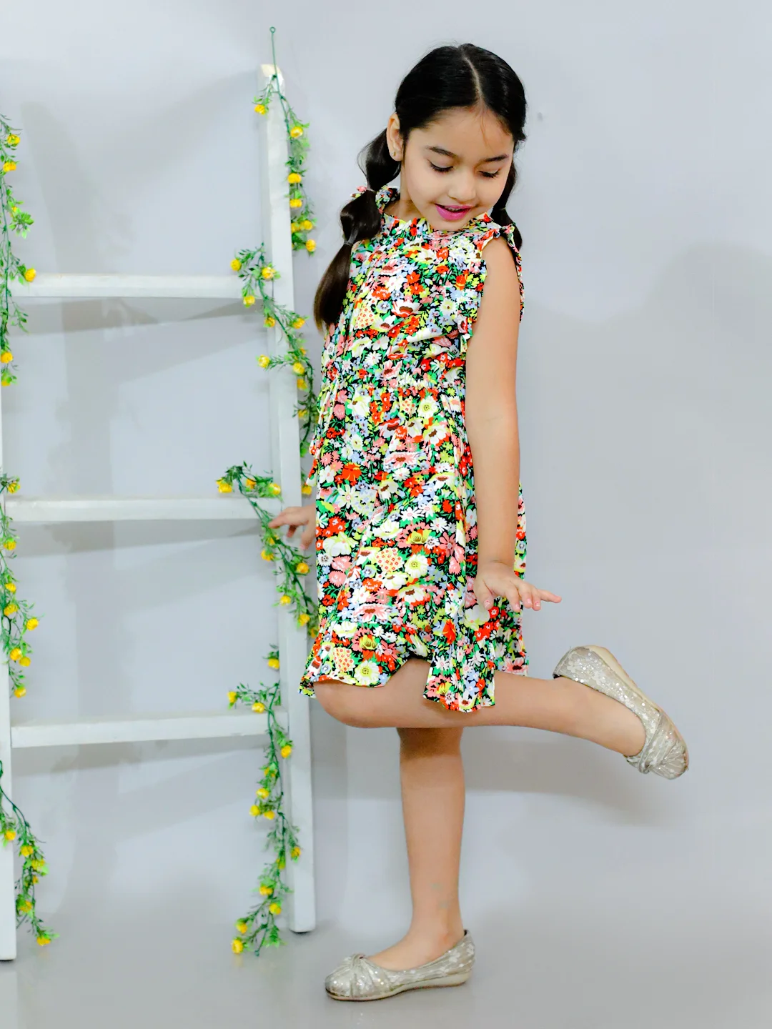 Sleevless all over printed A-Line knee length dress comes with flared hem Multi